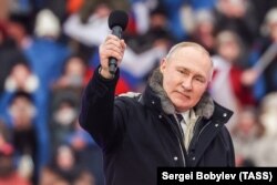 Президент России Владимир Путин на стадионе в Лужниках во время выступления в рамках митинг-концерта «Слава защитникам Отечества», посвященного войне в Украине. Москва, 22 февраля 2023 года