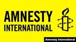 Amnesty International ұйымының логотипі.