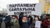 Kazakhstan. A woman with a placard at a rally in Almaty, November 14, 20